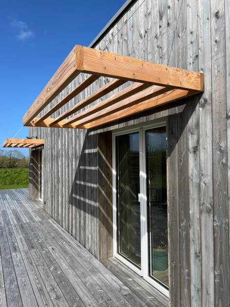 Les règles principales de la mise en œuvre du bardage en ossature bois selon le DTU